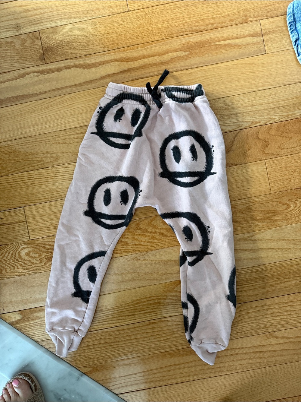 nununu Pink Joggers with Black Smiley Print